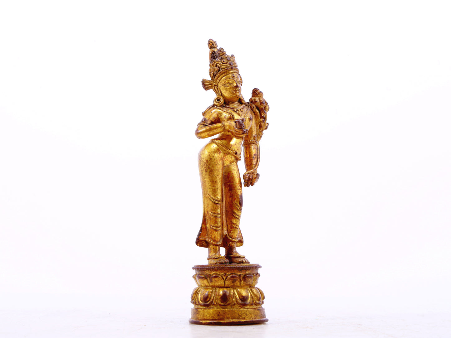 A serene gilt bronze statue of Tara