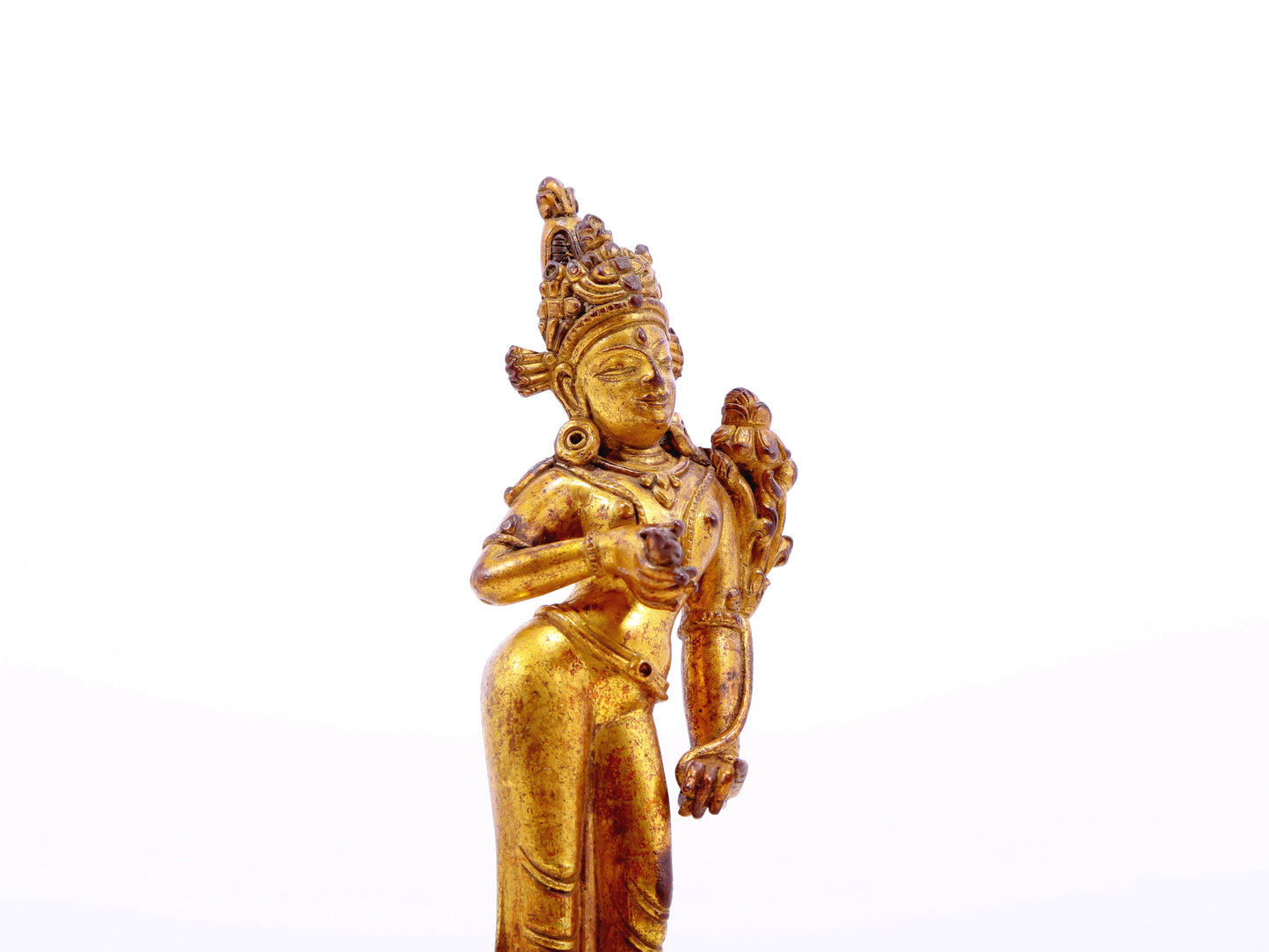 A serene gilt bronze statue of Tara