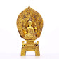 A serene gilt bronze statue of Gautama Buddha