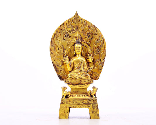 A serene gilt bronze statue of Gautama Buddha