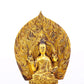 A serene gilt bronze statue of Gautama Buddha