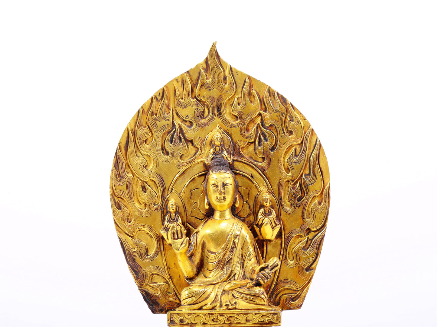 A serene gilt bronze statue of Gautama Buddha