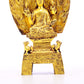 A serene gilt bronze statue of Gautama Buddha