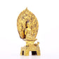 A serene gilt bronze statue of Gautama Buddha