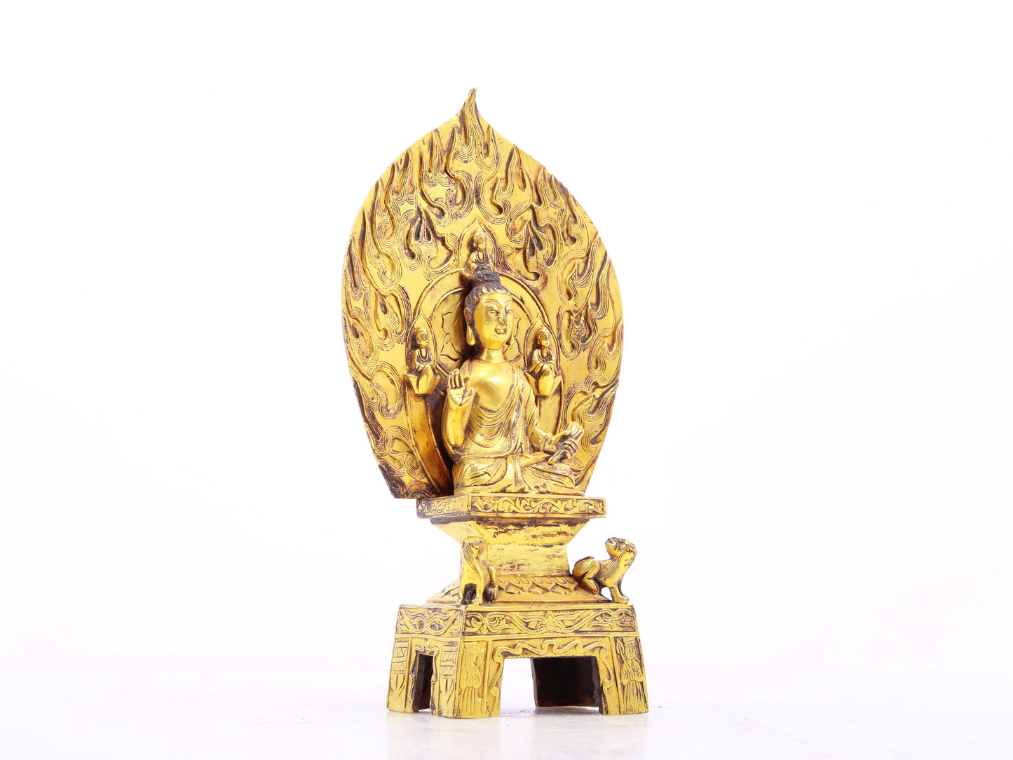 A serene gilt bronze statue of Gautama Buddha