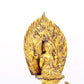 A serene gilt bronze statue of Gautama Buddha