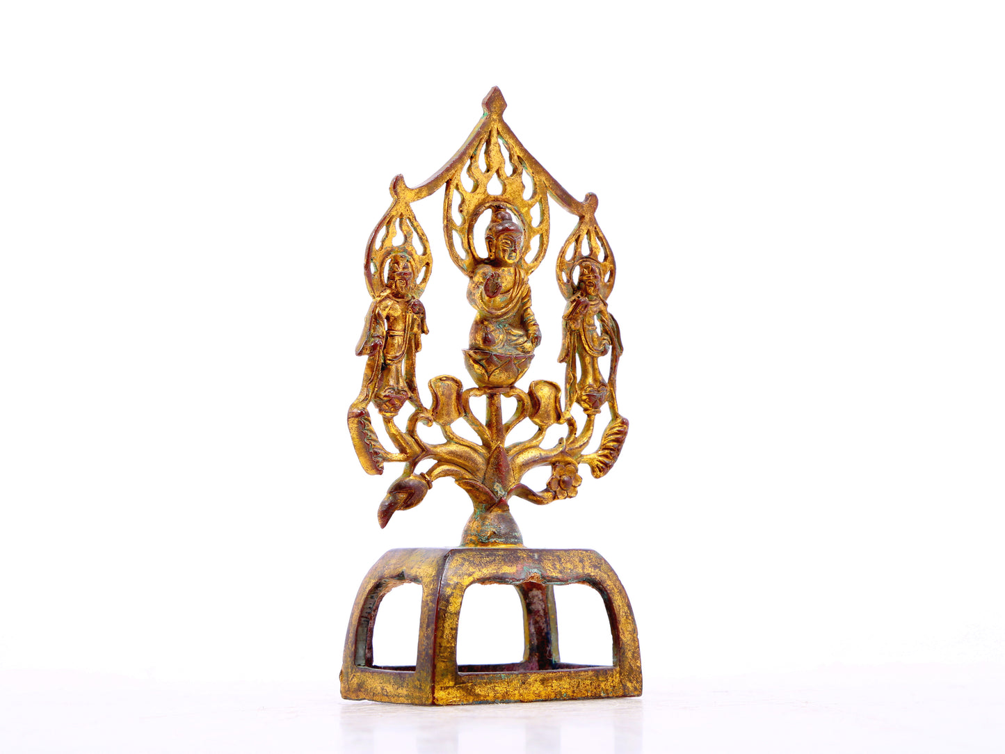 A serene gilt bronze statue of Gautama Buddha