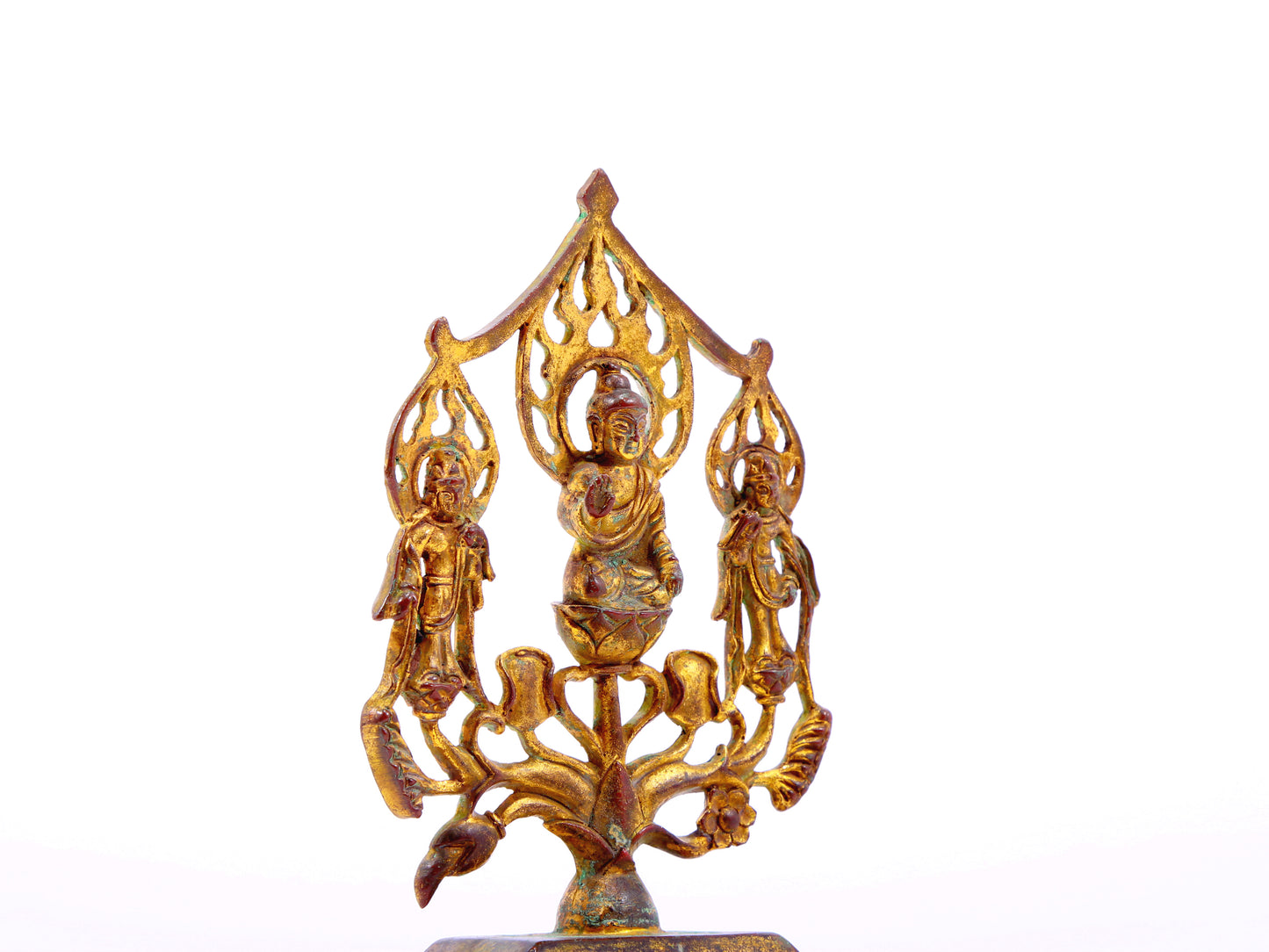 A serene gilt bronze statue of Gautama Buddha