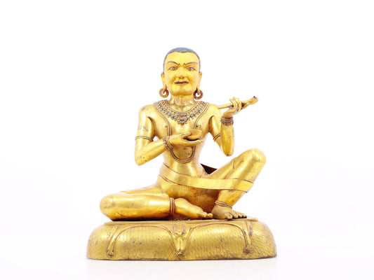 A solemn gilt bronze figure inlaid with turquoise