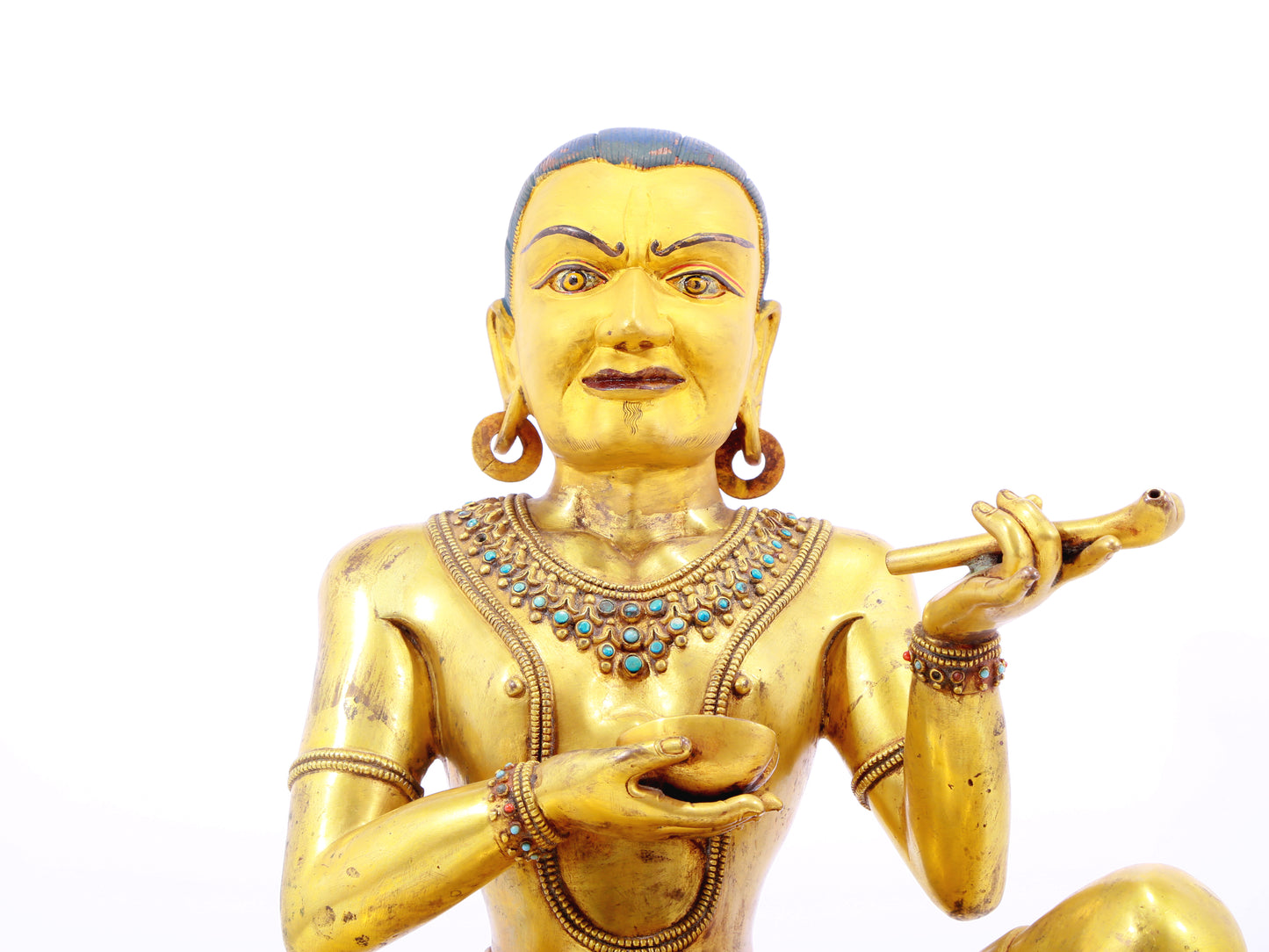 A solemn gilt bronze figure inlaid with turquoise