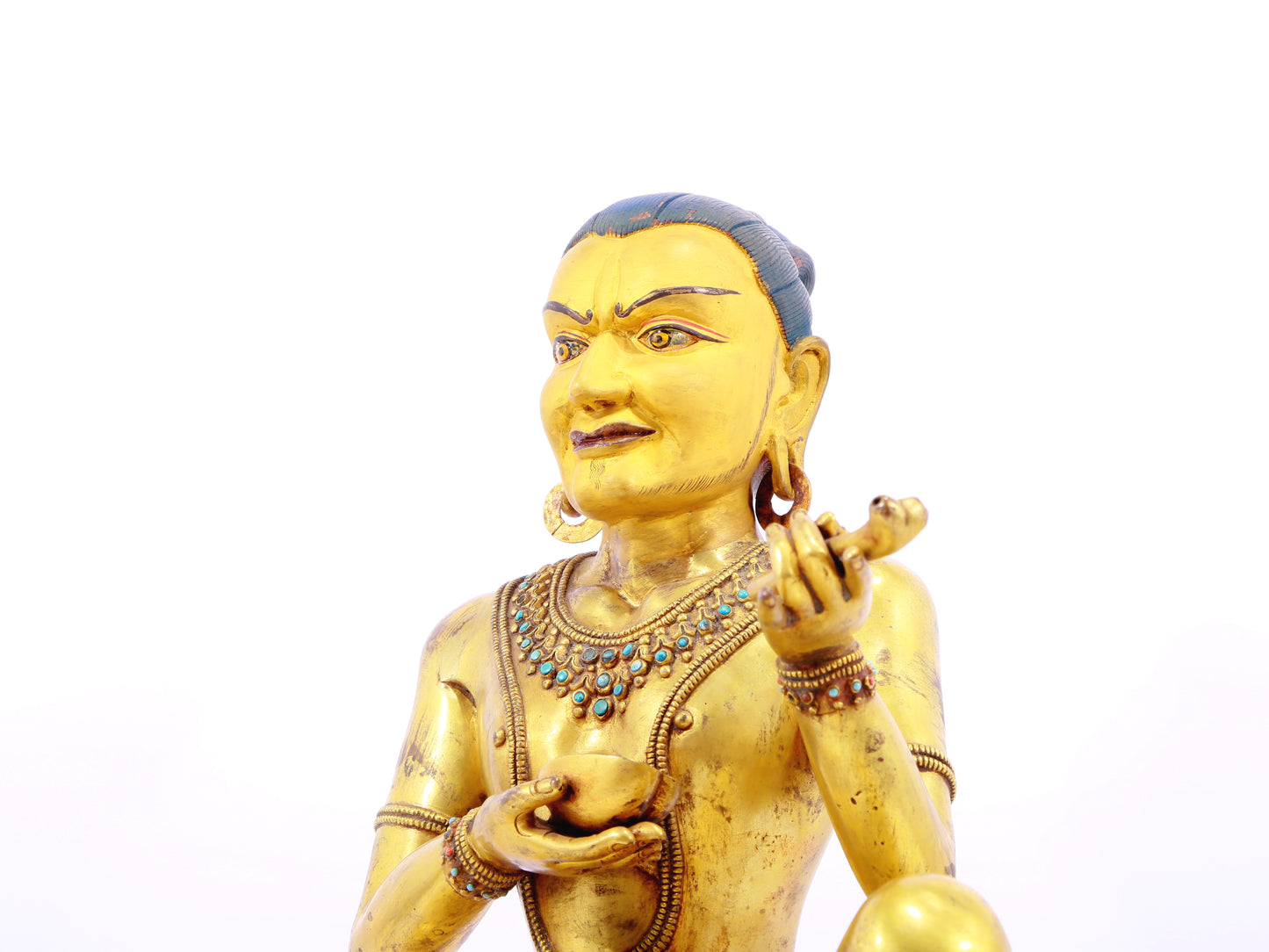 A solemn gilt bronze figure inlaid with turquoise