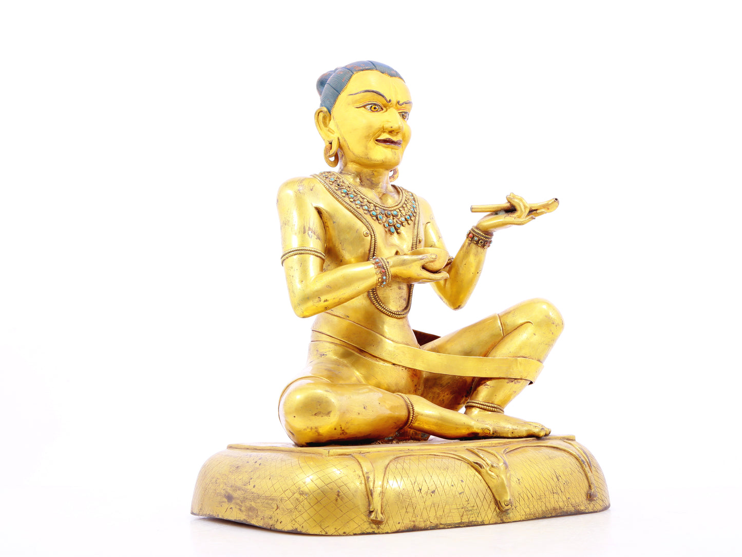 A solemn gilt bronze figure inlaid with turquoise