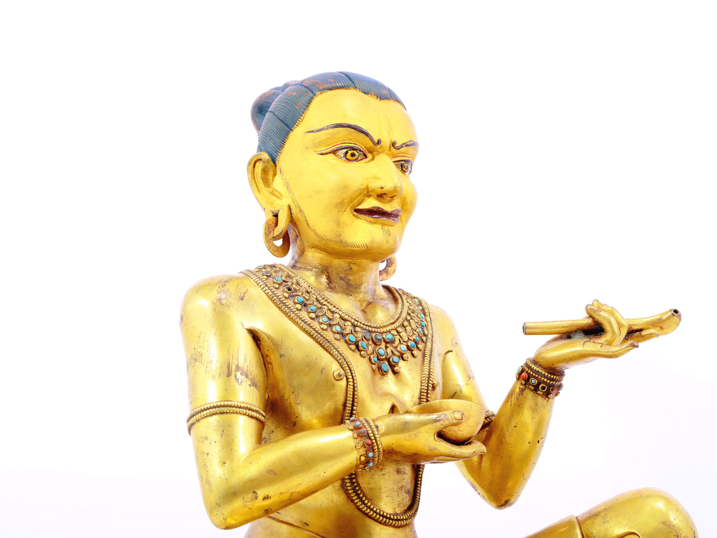 A solemn gilt bronze figure inlaid with turquoise