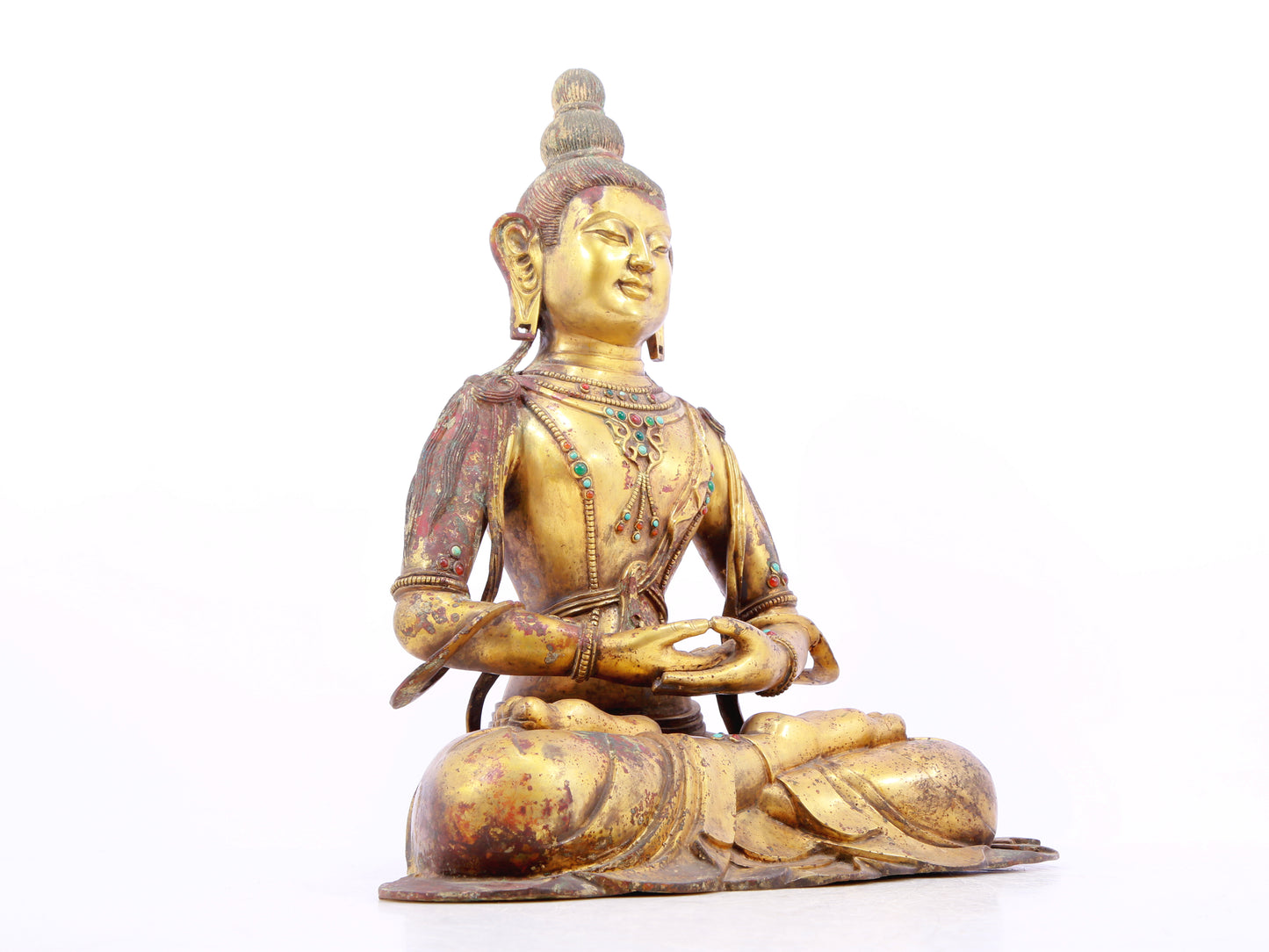 A solemn gilt bronze statue of Bodhisattva inlaid with precious stones