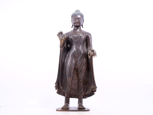 A solemn alloy bronze statue of Gautama Buddha