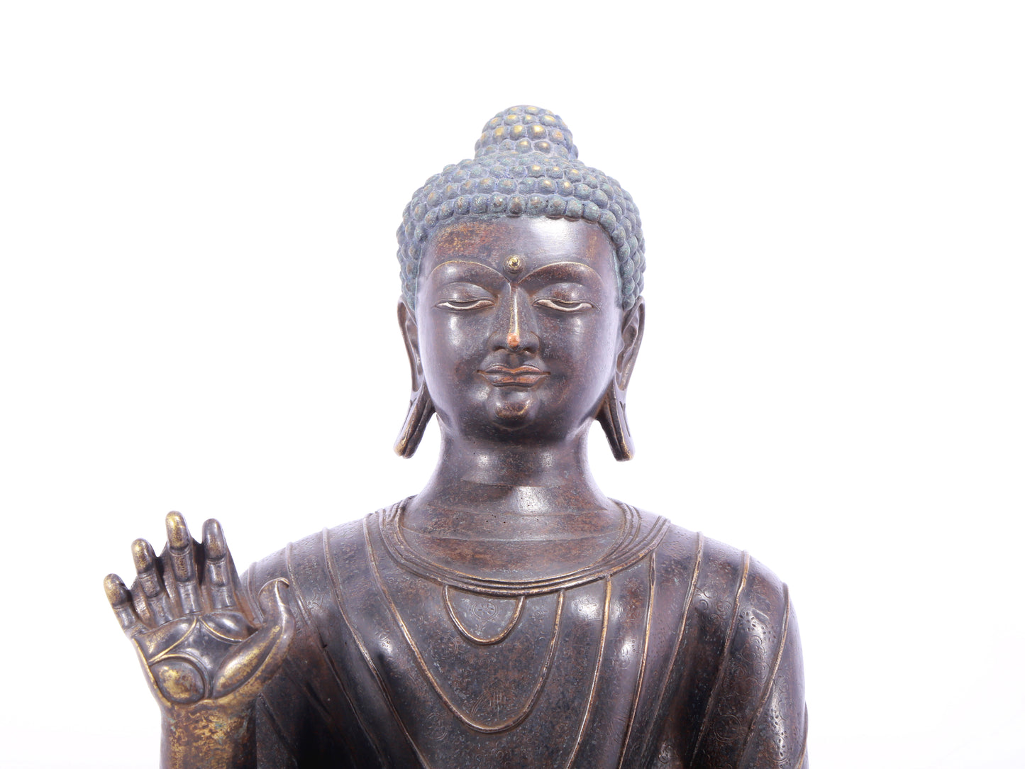 A solemn alloy bronze statue of Gautama Buddha