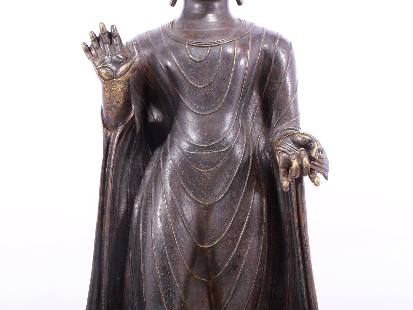 A solemn alloy bronze statue of Gautama Buddha