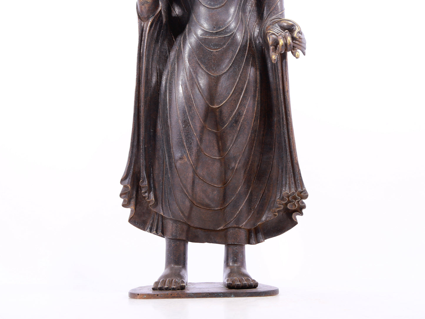 A solemn alloy bronze statue of Gautama Buddha