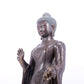 A solemn alloy bronze statue of Gautama Buddha