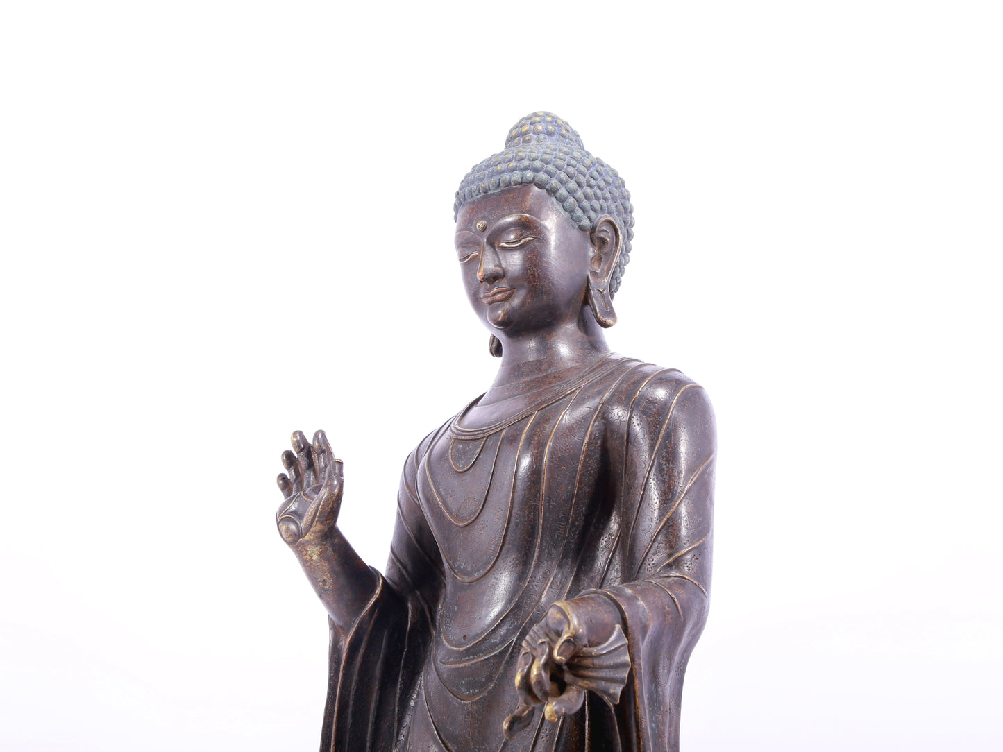 A solemn alloy bronze statue of Gautama Buddha