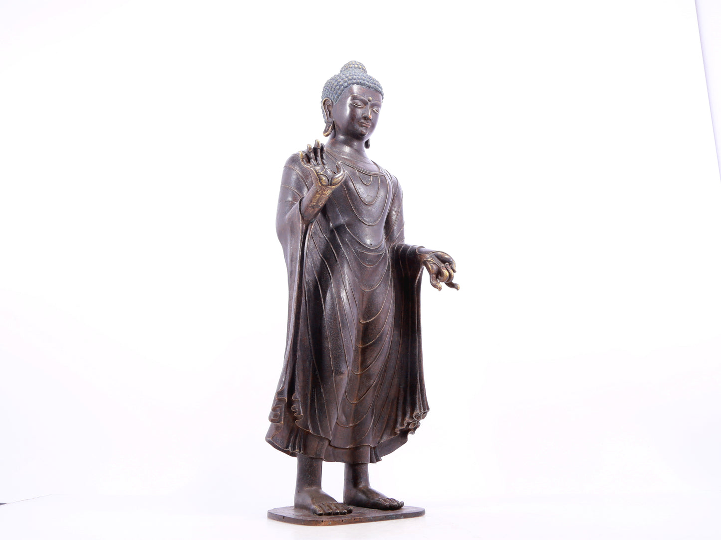 A solemn alloy bronze statue of Gautama Buddha