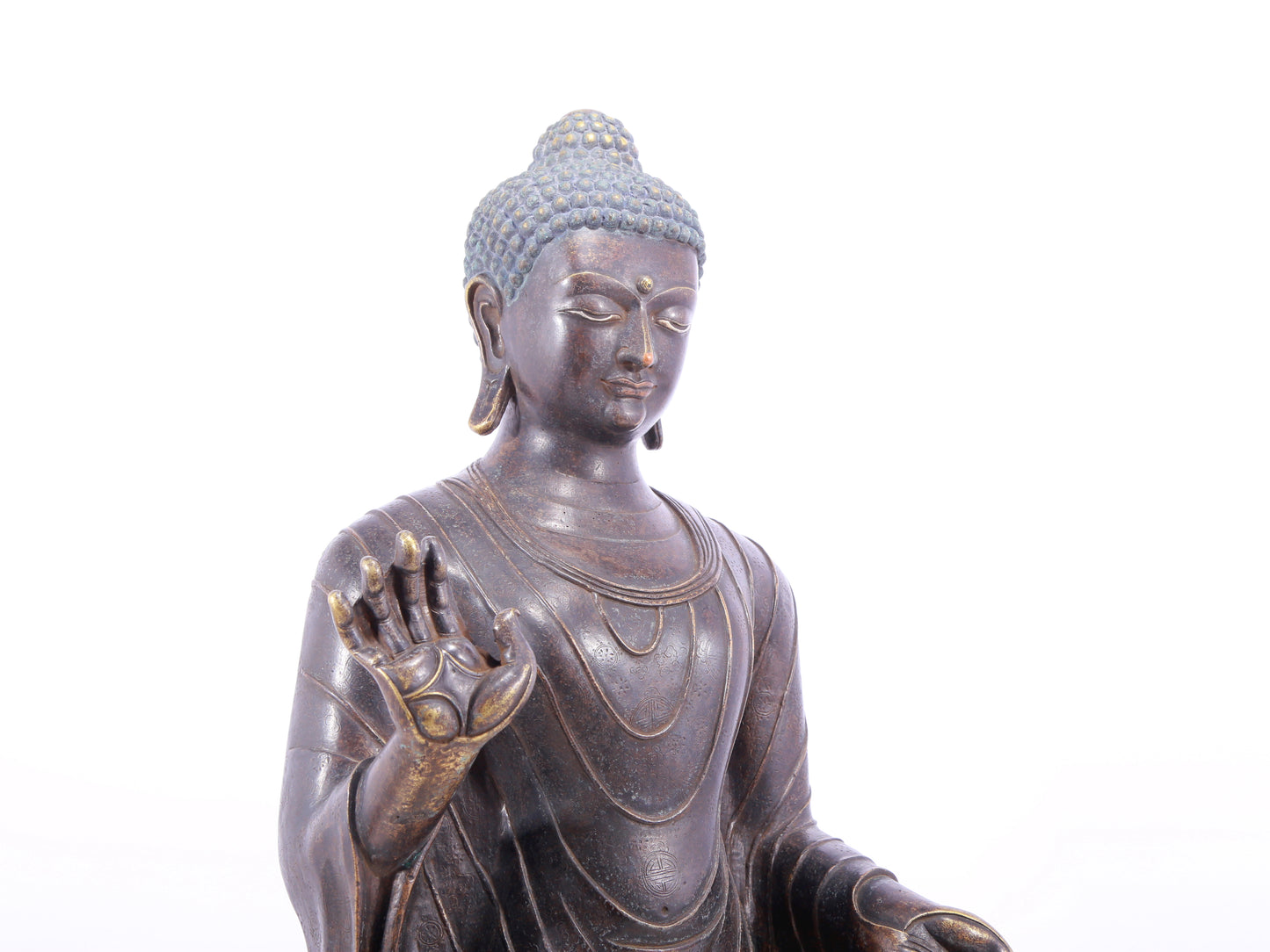 A solemn alloy bronze statue of Gautama Buddha