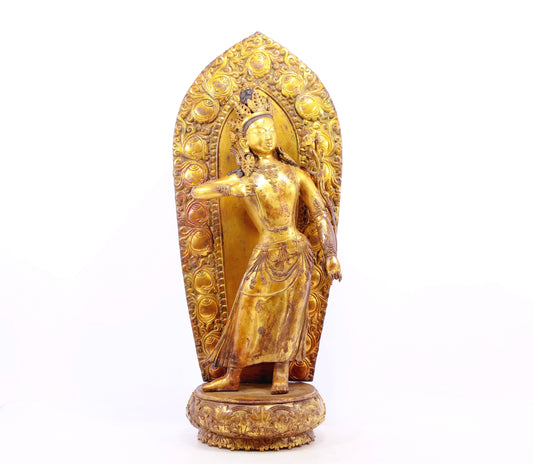 A solemn gilt bronze statue of Tara