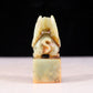 An exquisite green and white jade auspicious animal seal