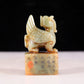 An exquisite green and white jade auspicious animal seal