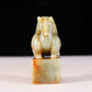 An exquisite green and white jade auspicious animal seal