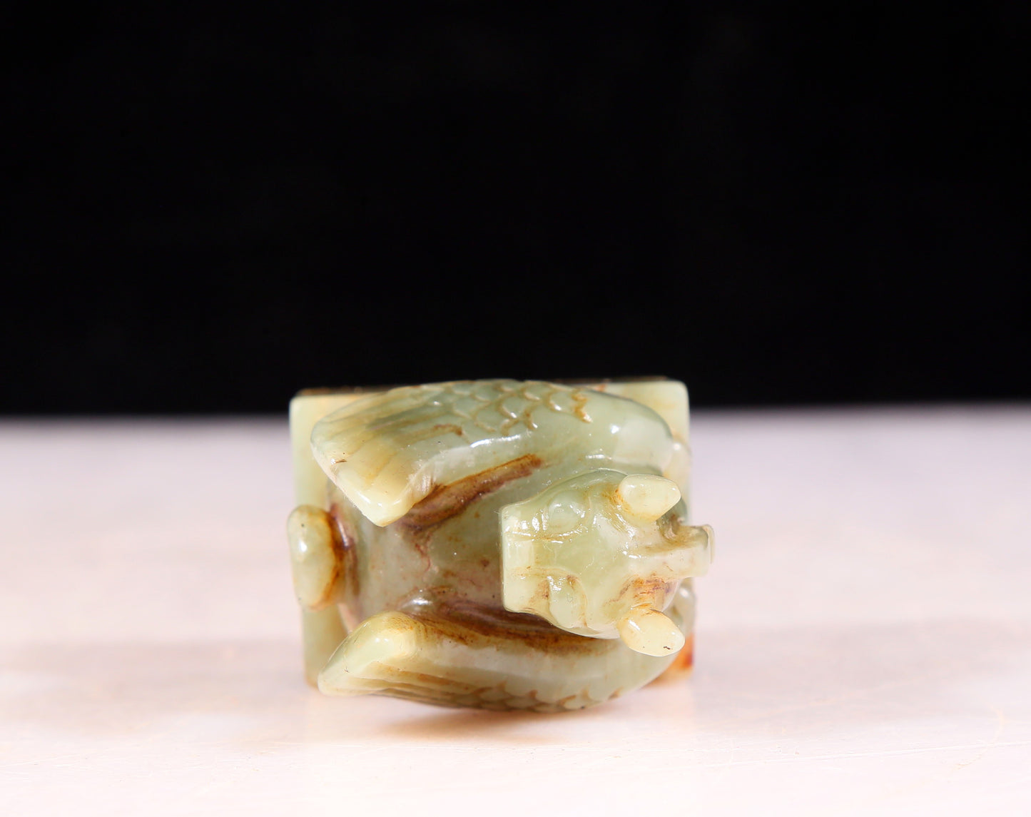 An exquisite green and white jade auspicious animal seal