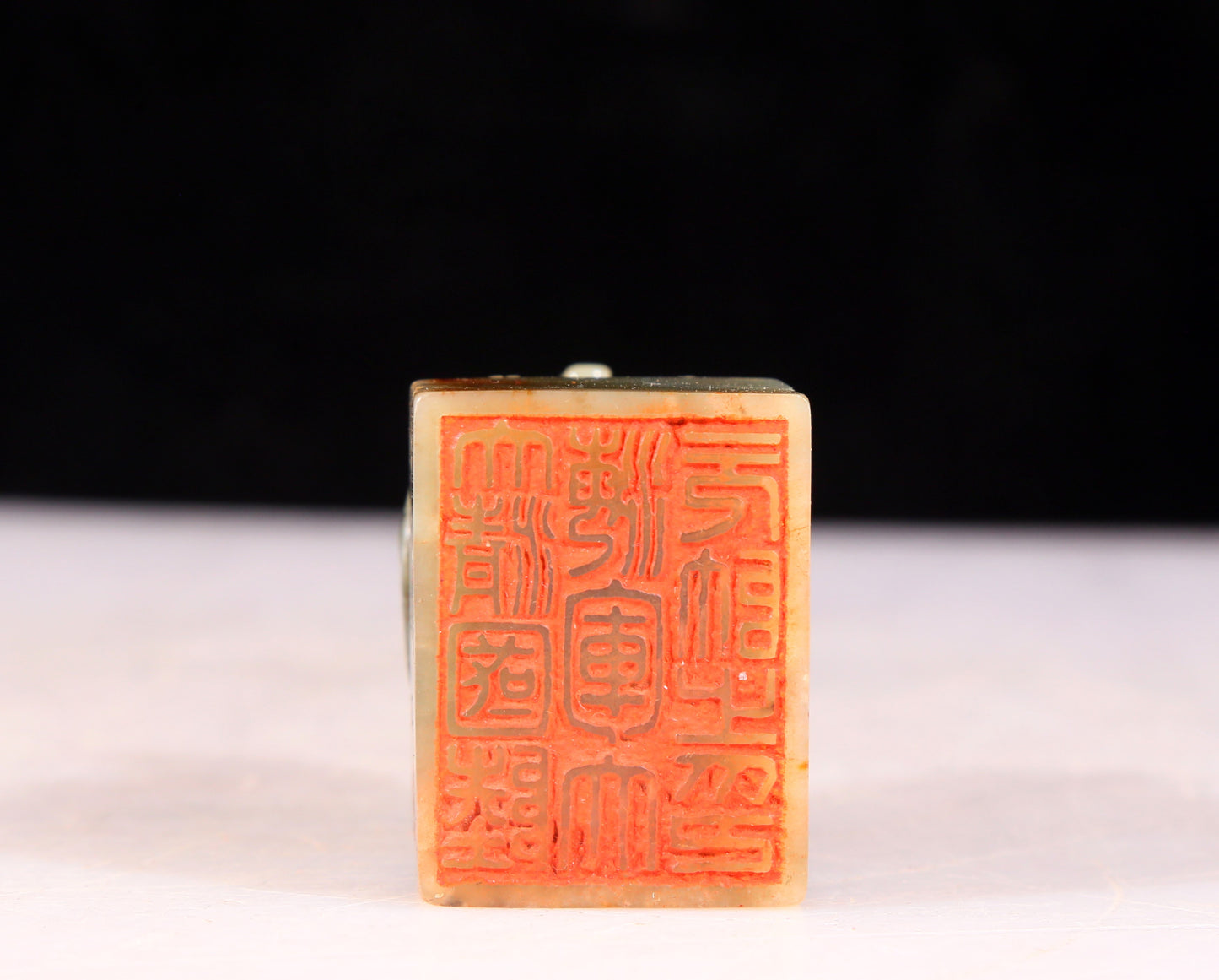 An exquisite green and white jade auspicious animal seal