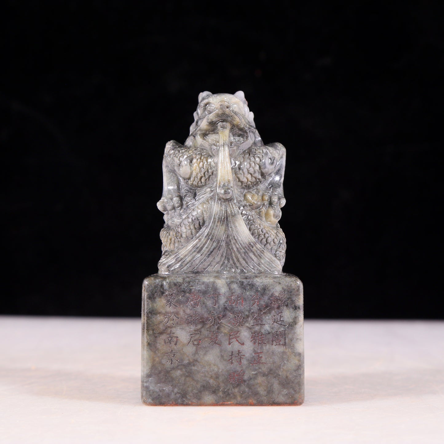 An exquisite black and white jade dragon seal