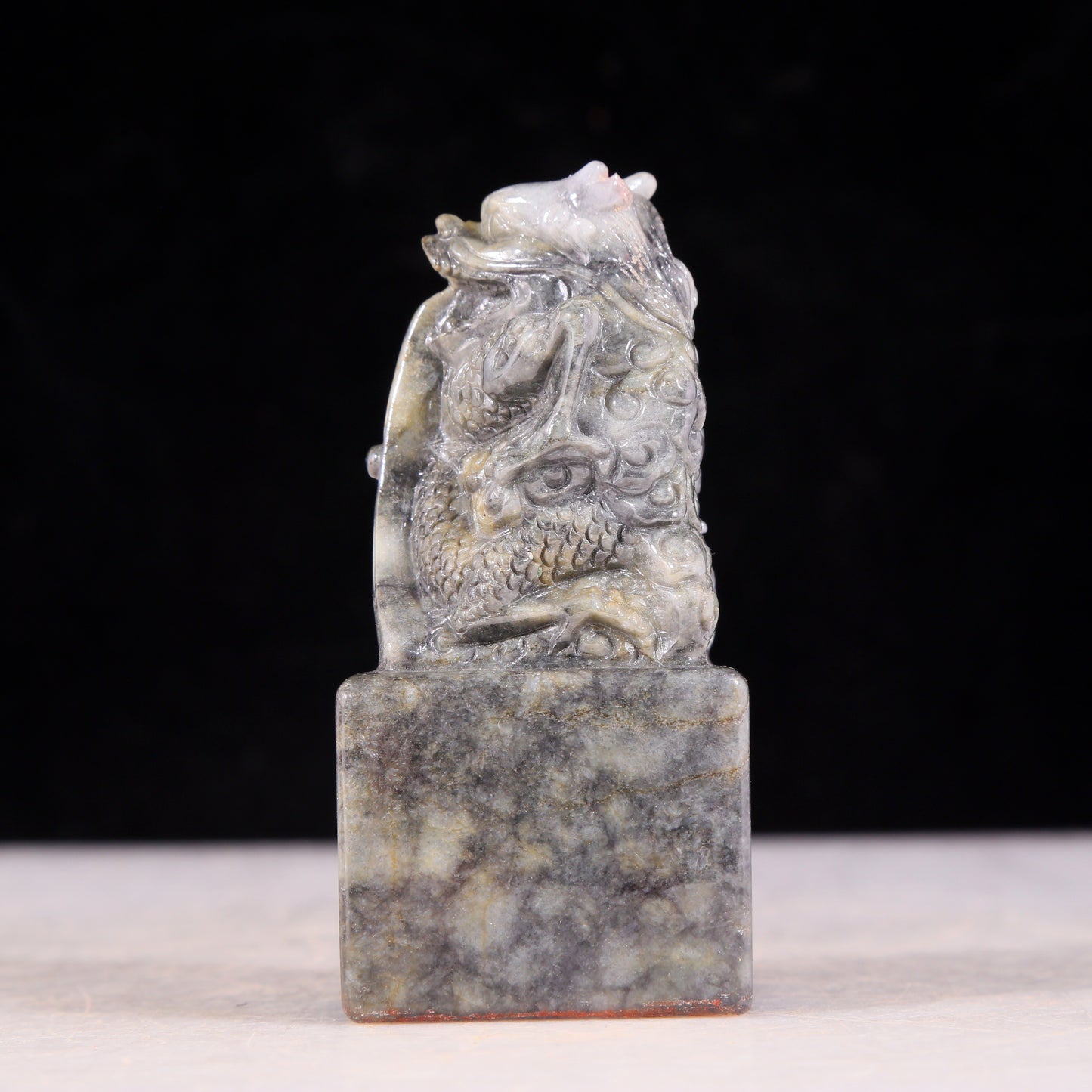 An exquisite black and white jade dragon seal