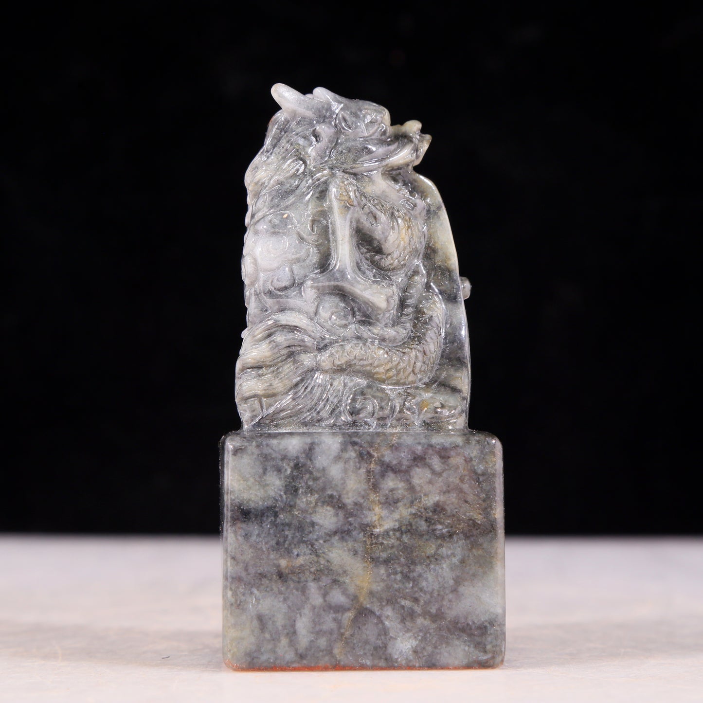 An exquisite black and white jade dragon seal