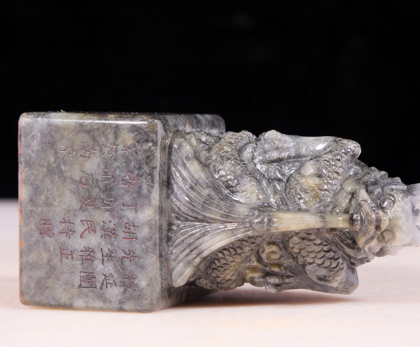 An exquisite black and white jade dragon seal