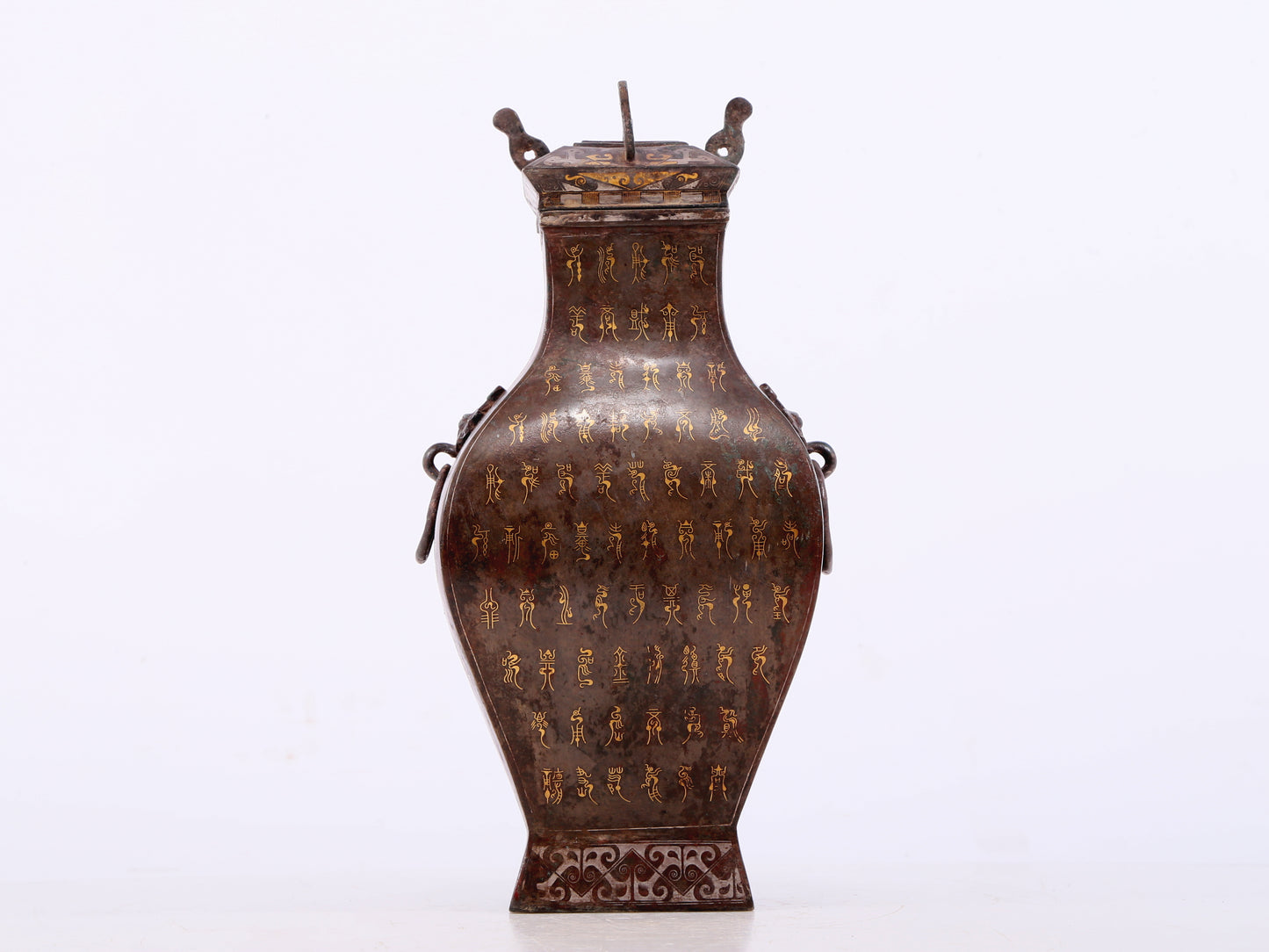 An exquisite bronze inlaid gold and silver animal ear bottle with lid