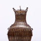 An exquisite bronze inlaid gold and silver animal ear bottle with lid