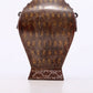 An exquisite bronze inlaid gold and silver animal ear bottle with lid