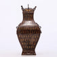 An exquisite bronze inlaid gold and silver animal ear bottle with lid