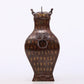 An exquisite bronze inlaid gold and silver animal ear bottle with lid