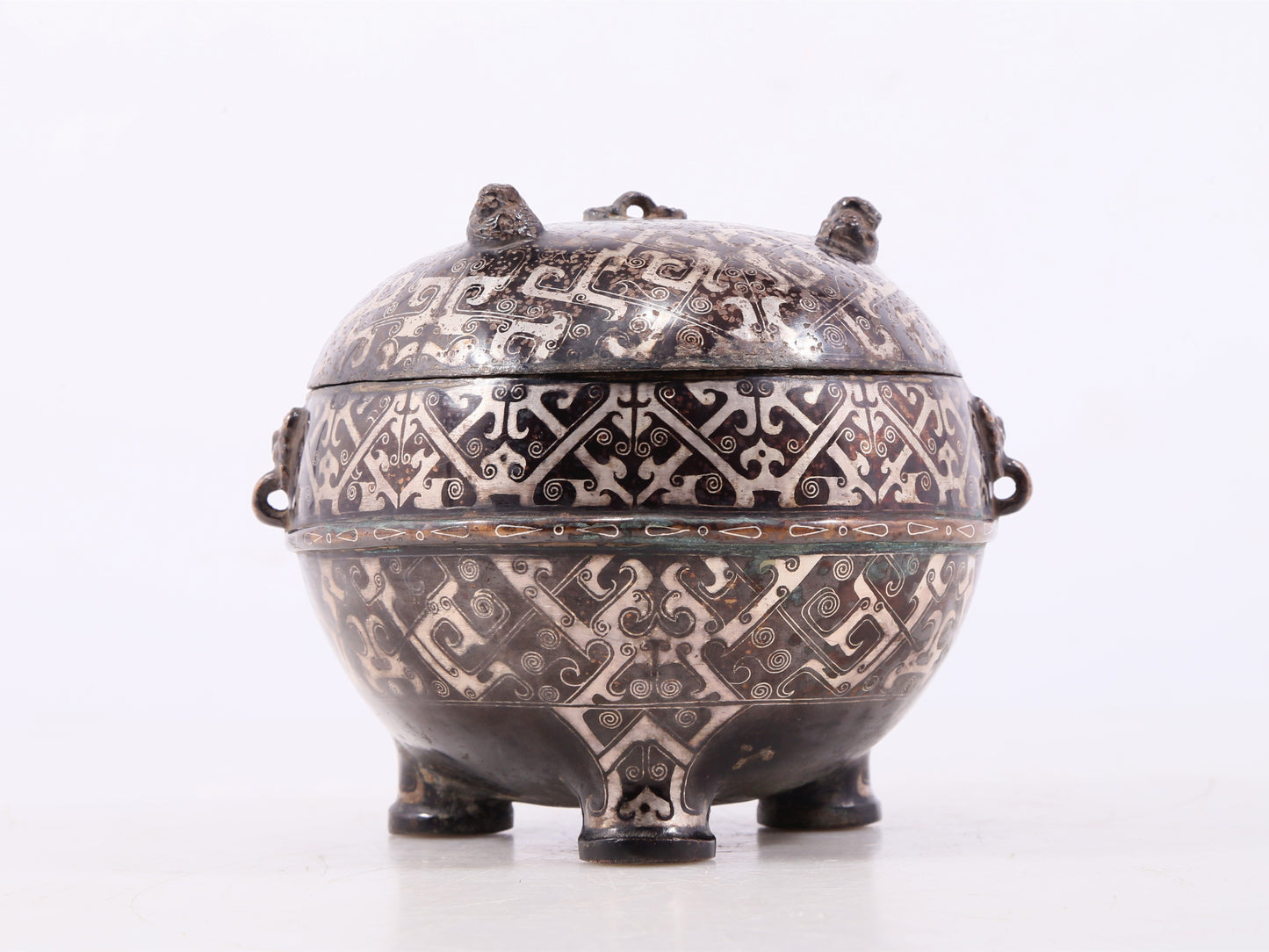 An exquisite bronze-inlaid silver animal-eared tripod jar with lid