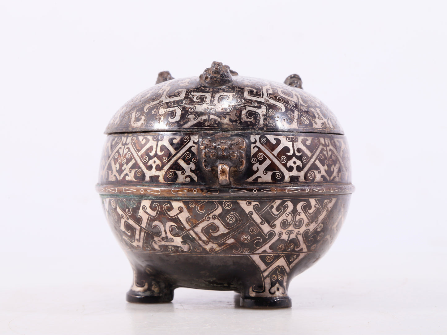 An exquisite bronze-inlaid silver animal-eared tripod jar with lid