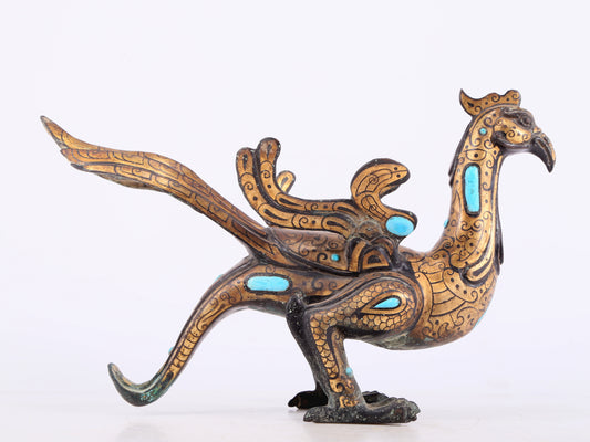 An exquisite bronze inlaid gold and turquoise phoenix ornament