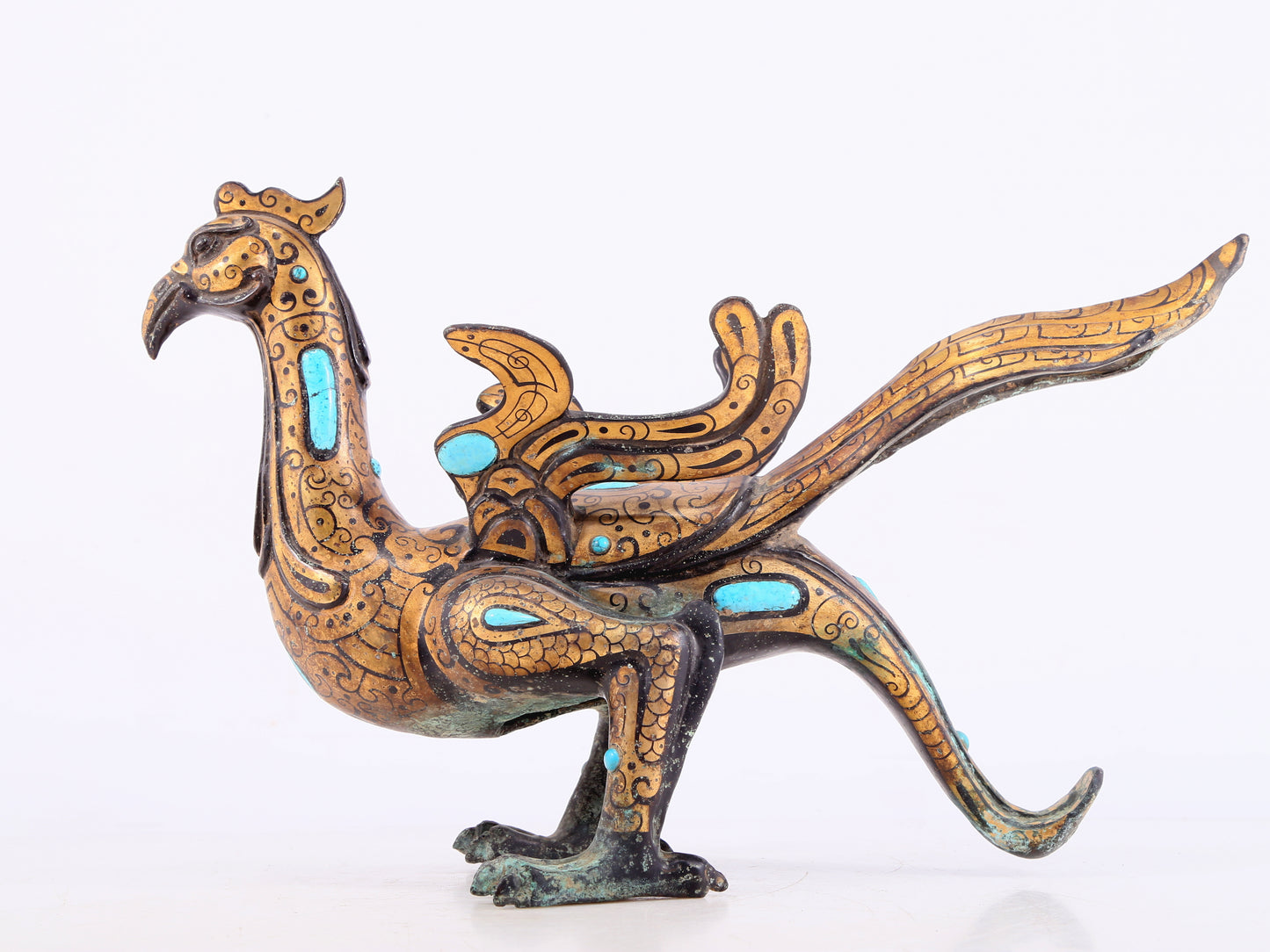 An exquisite bronze inlaid gold and turquoise phoenix ornament