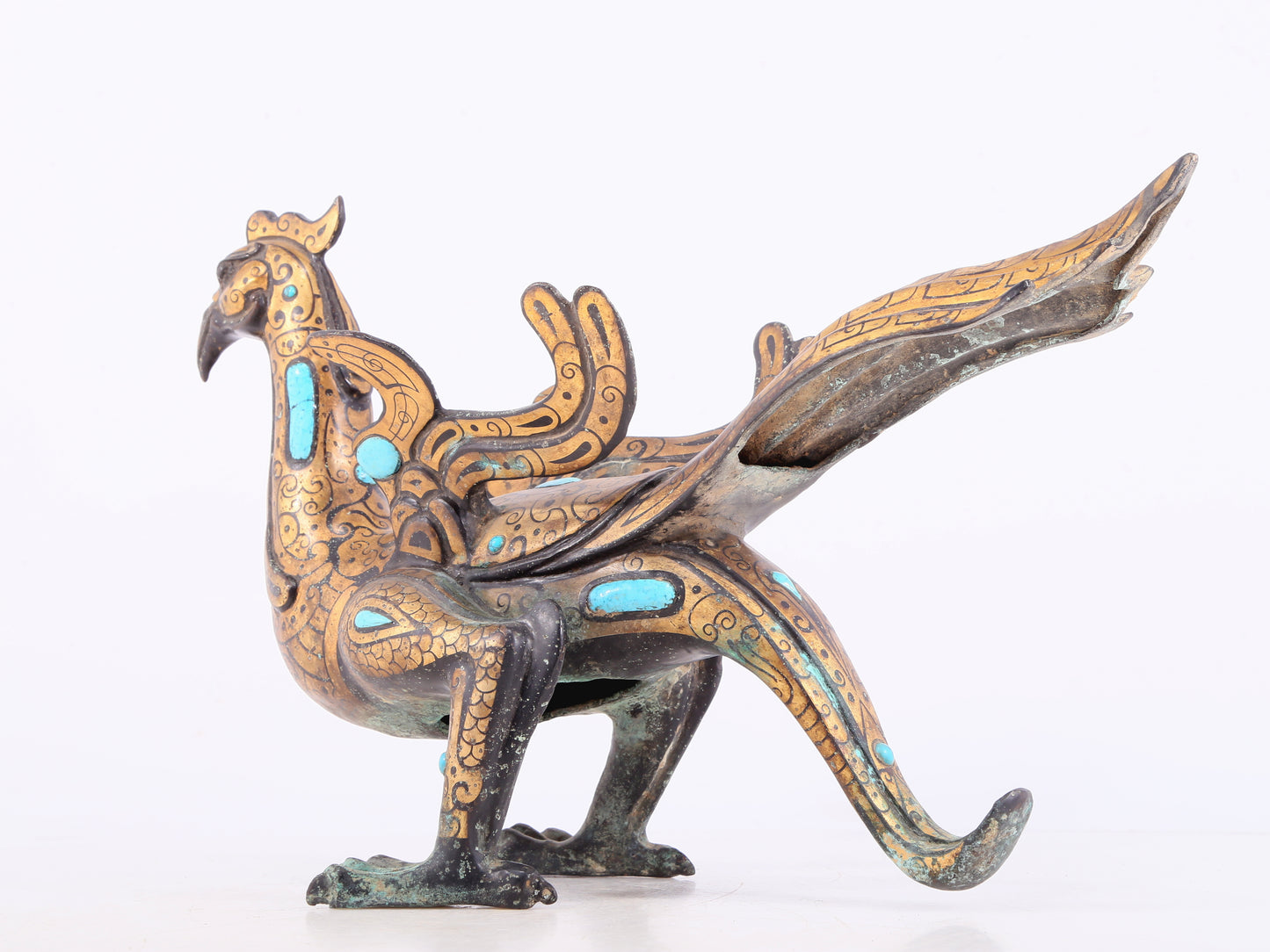 An exquisite bronze inlaid gold and turquoise phoenix ornament