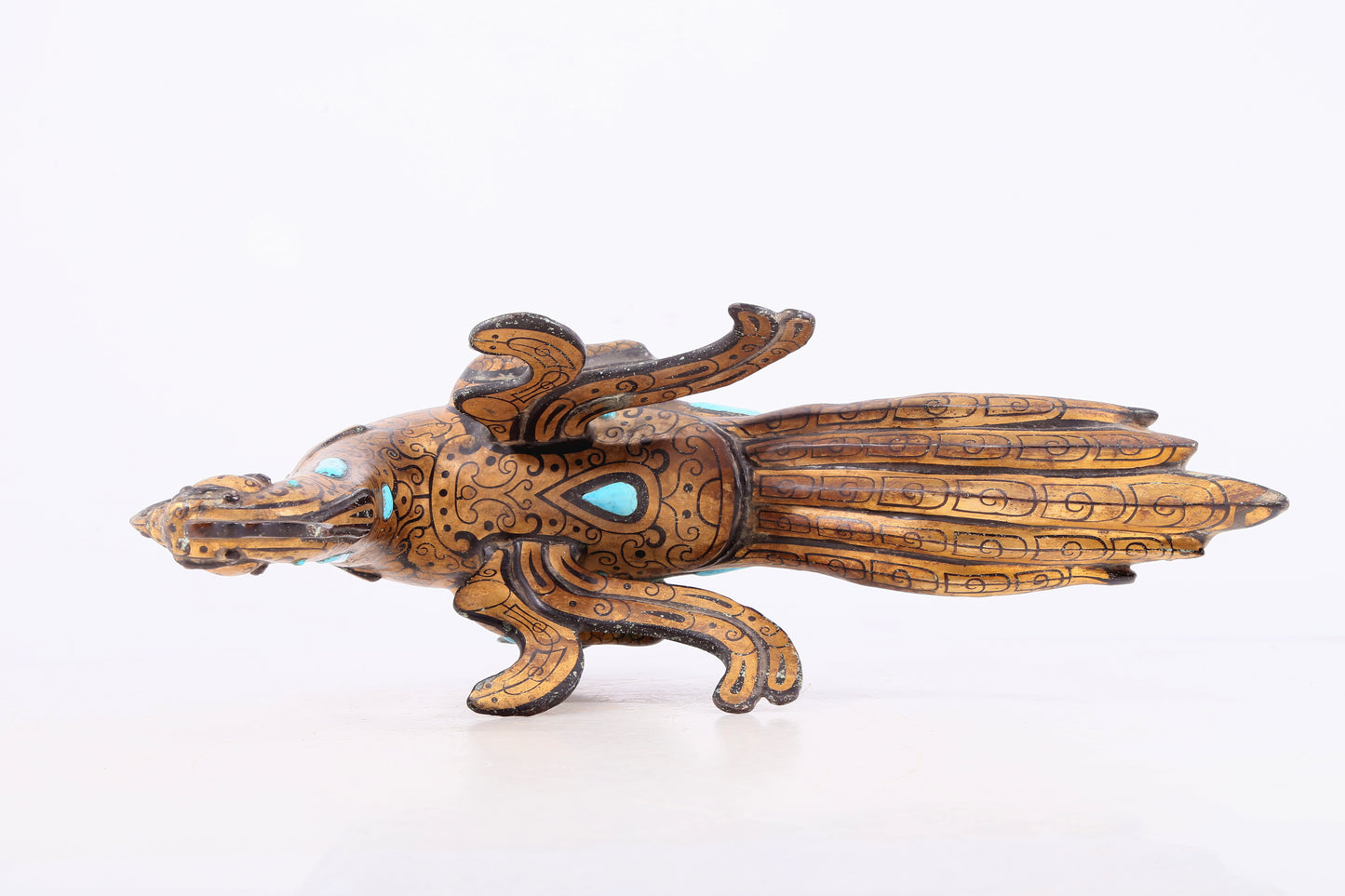 An exquisite bronze inlaid gold and turquoise phoenix ornament