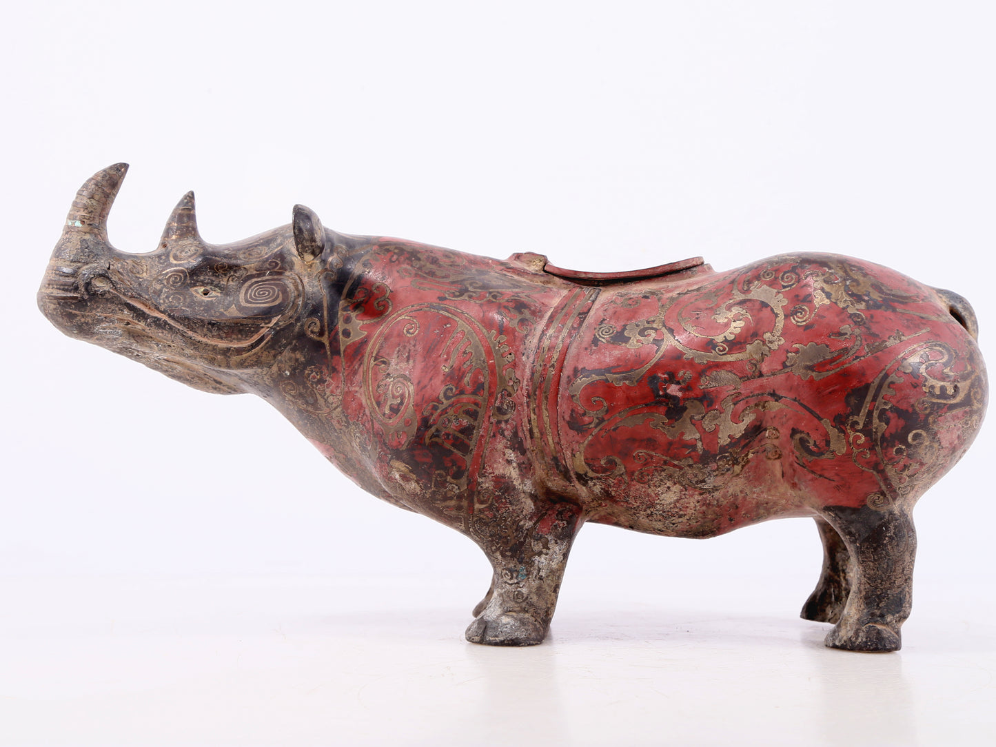 An exquisite bronze-inlaid silver rhinoceros ornament