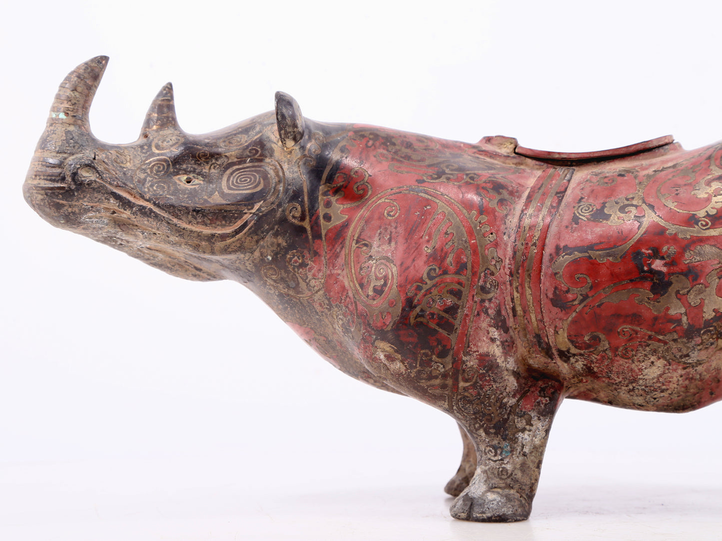 An exquisite bronze-inlaid silver rhinoceros ornament