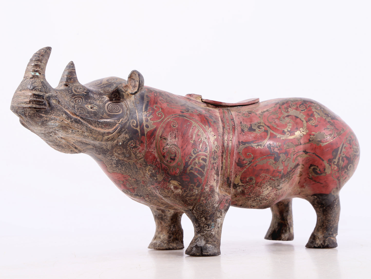 An exquisite bronze-inlaid silver rhinoceros ornament